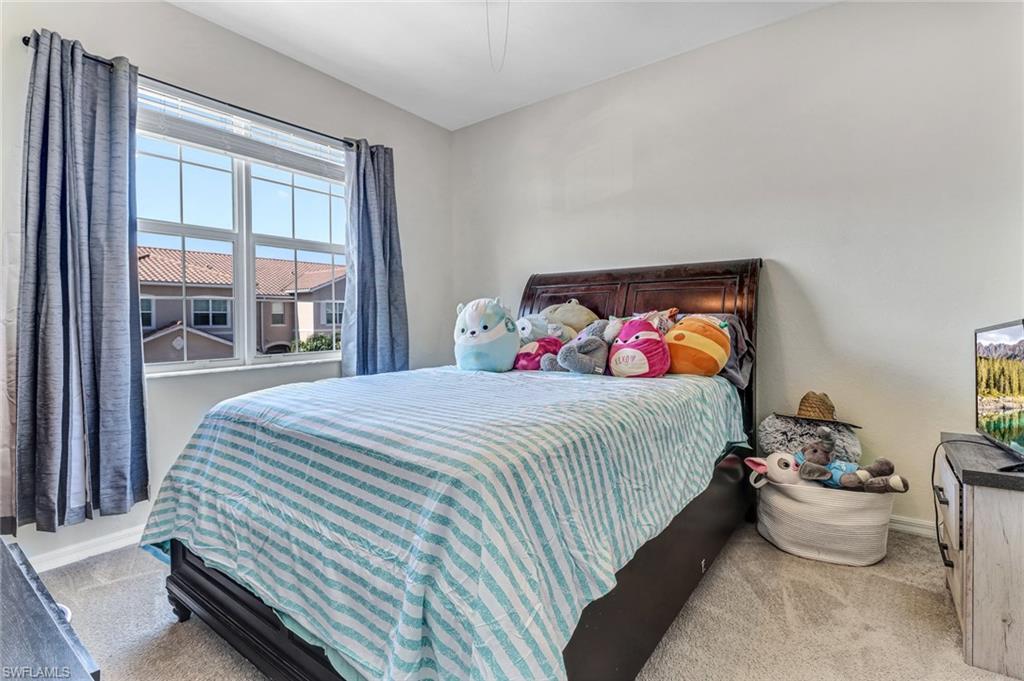 2722 Citrus Street Naples, FL 34120 - Photo 19 of 35 a bedroom with bed and window