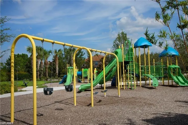 a view of a swimming pool with a table and chairs
