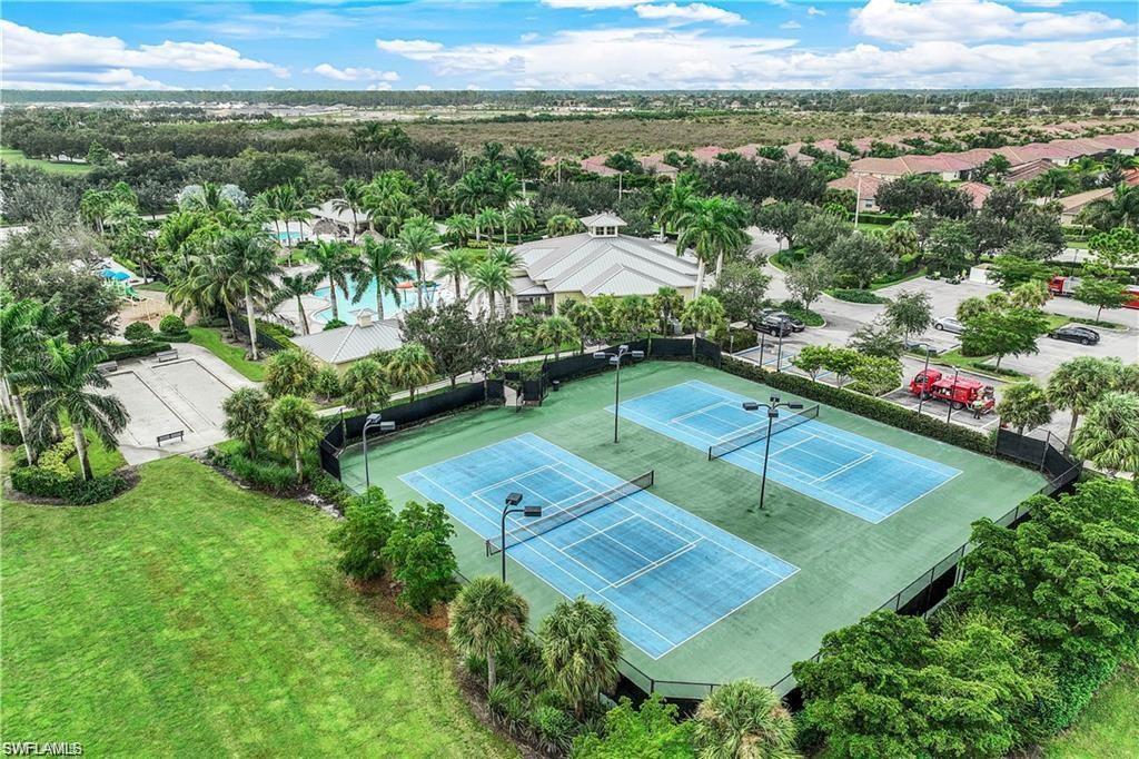 2722 Citrus Street Naples, FL 34120 - Photo 33 of 35 an aerial view of residential houses with outdoor space and trees