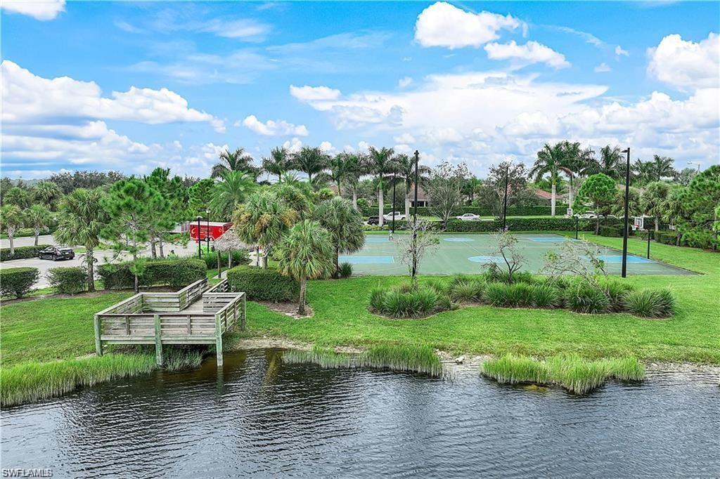 2722 Citrus Street Naples, FL 34120 - Photo 35 of 35 a view of a lake with a garden