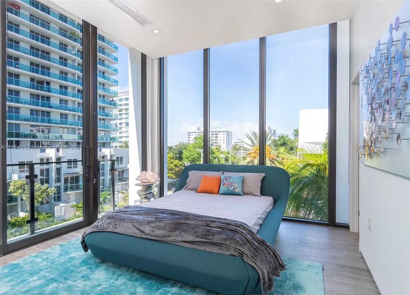 1525 Bay Road Miami Beach, FL 33139 - Photo 12 of 13 a bedroom with a large bed and a window