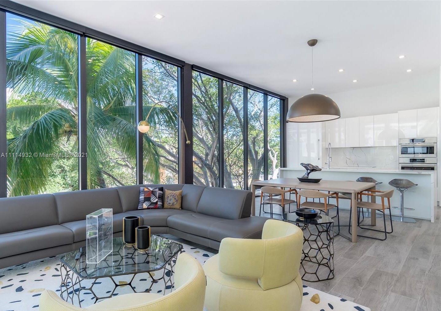 1525 Bay Road Miami Beach, FL 33139 - Photo 13 of 13 a living room with furniture and a large window