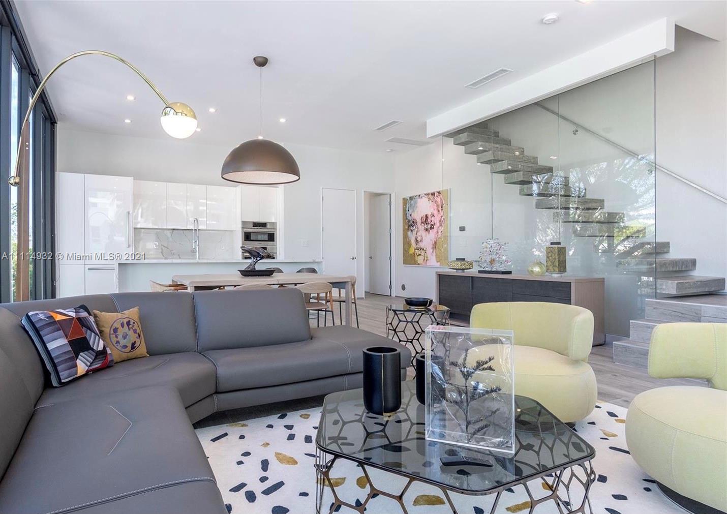 1525 Bay Road Miami Beach, FL 33139 - Photo 5 of 13 a living room with furniture and a large window