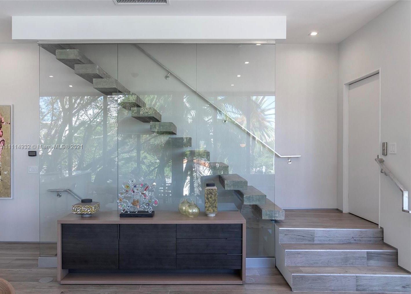 1525 Bay Road Miami Beach, FL 33139 - Photo 8 of 13 a view of entryway and hall with wooden floor