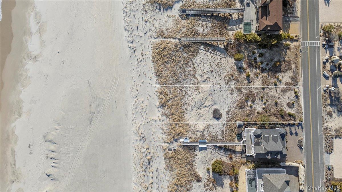 699 Dune Road Westhampton Beach, NY 11978 - Photo 3 of 9 view of a bathroom with a shower