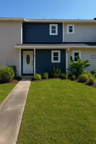 a front view of a house with garden