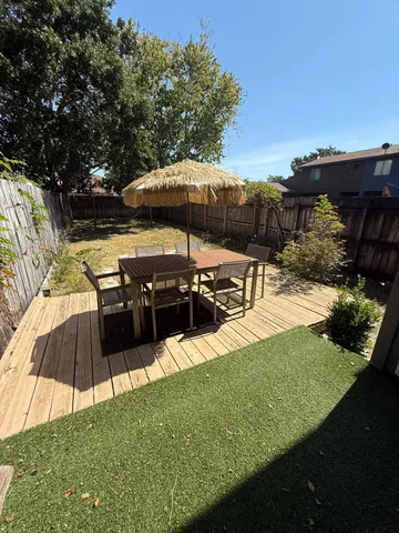 a view of a backyard with sitting area
