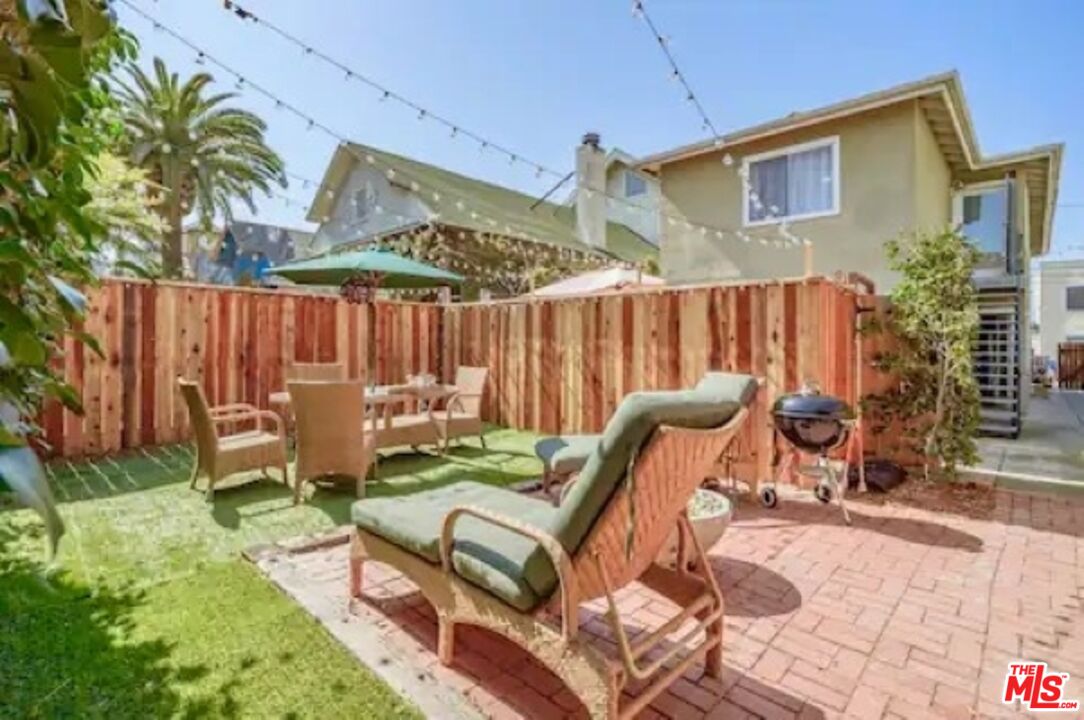 a view of a backyard with a patio