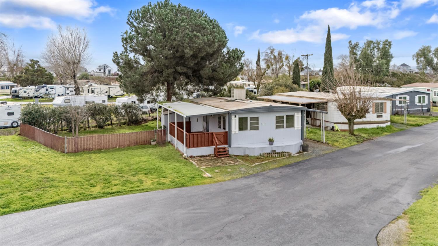 3505 Gateway Road, Unit F242 Bethel Island, CA 94511 - Photo 13 of 22 a front view of a house with a garden and trees