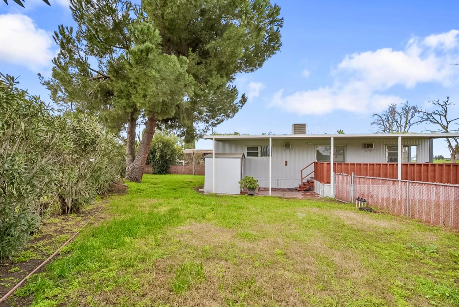 3505 Gateway Road, Unit F242 Bethel Island, CA 94511 - Photo 15 of 22 a view of a house with a yard and sitting area