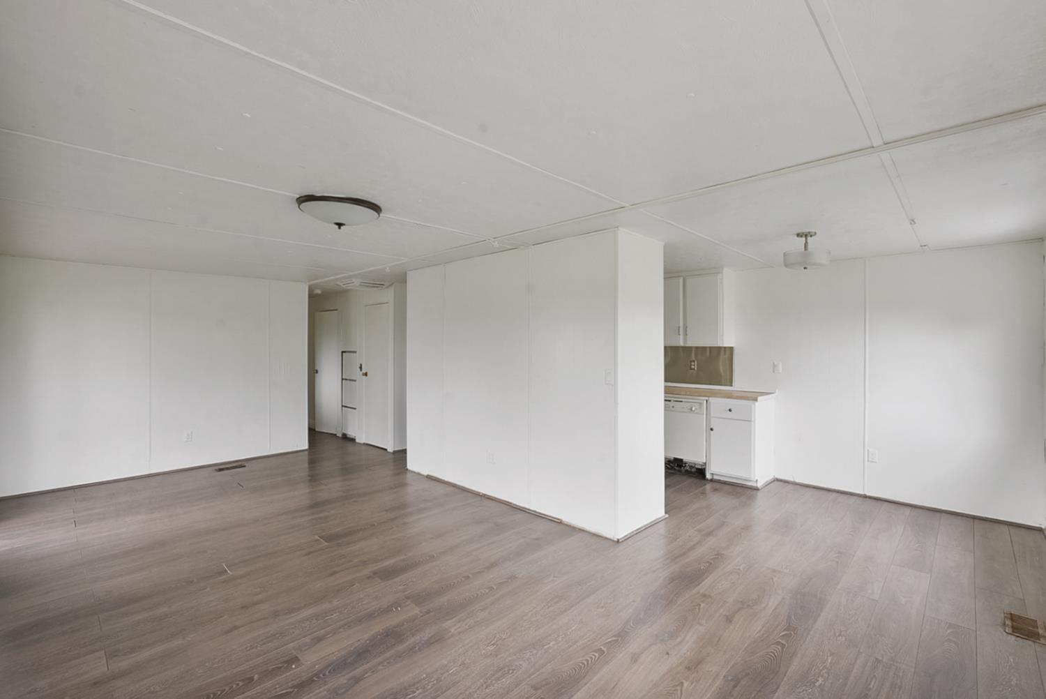 3505 Gateway Road, Unit F242 Bethel Island, CA 94511 - Photo 3 of 22 a view of empty room with wooden floor