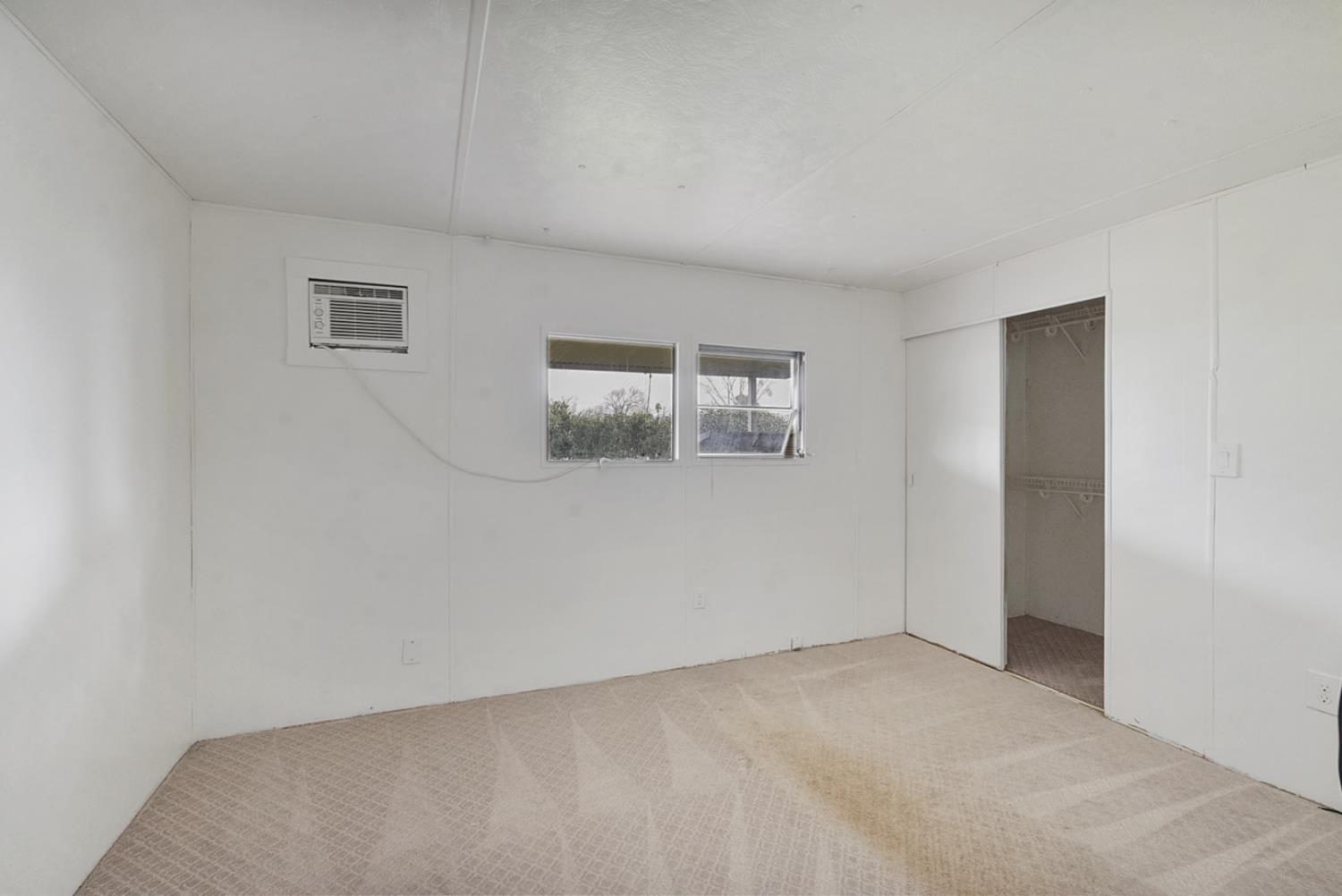 3505 Gateway Road, Unit F242 Bethel Island, CA 94511 - Photo 9 of 22 an empty room with windows
