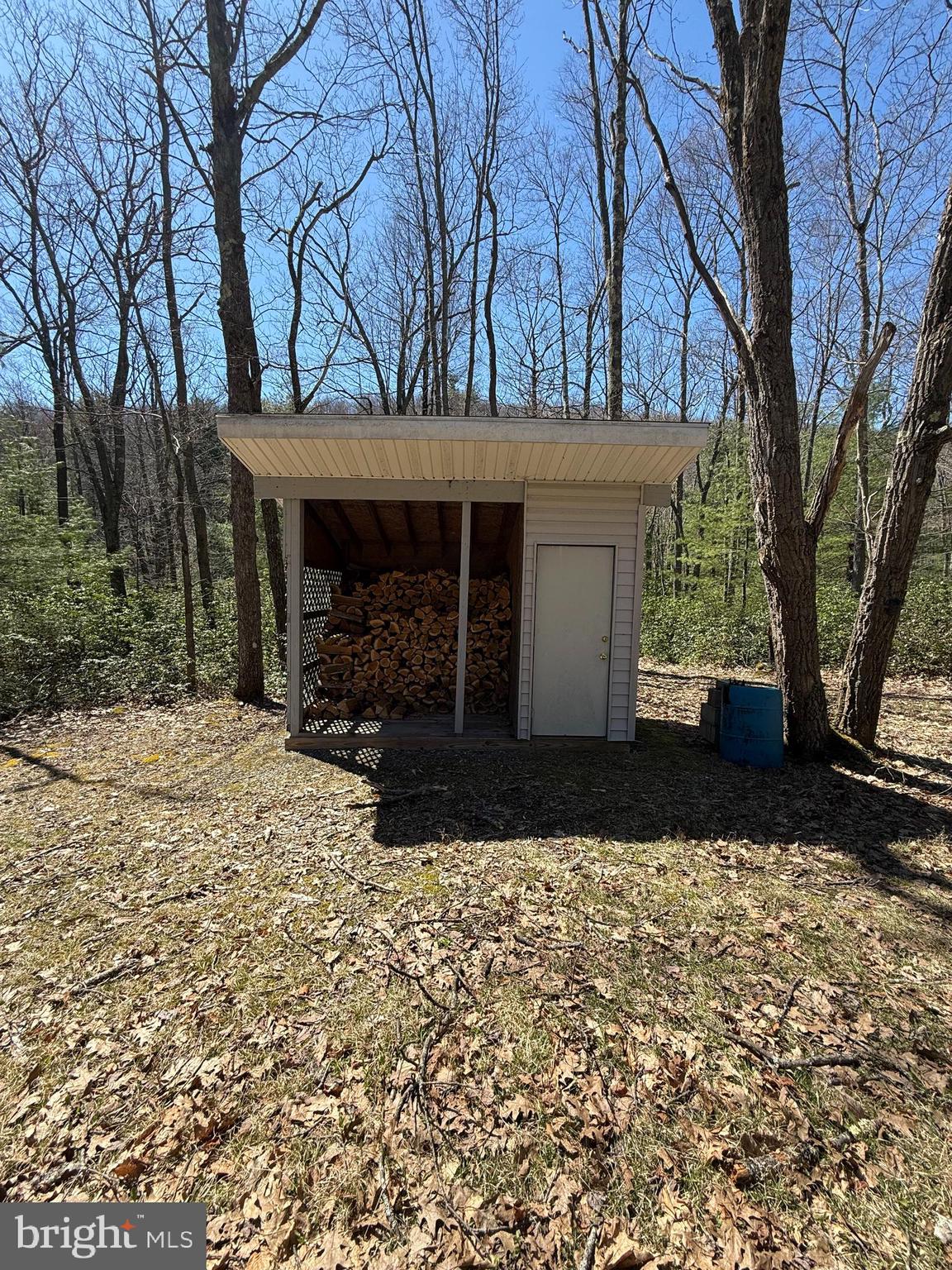 1922 Ames Road Frenchville, PA 16836 - Photo 15 of 16 a view of a house with a yard and garage