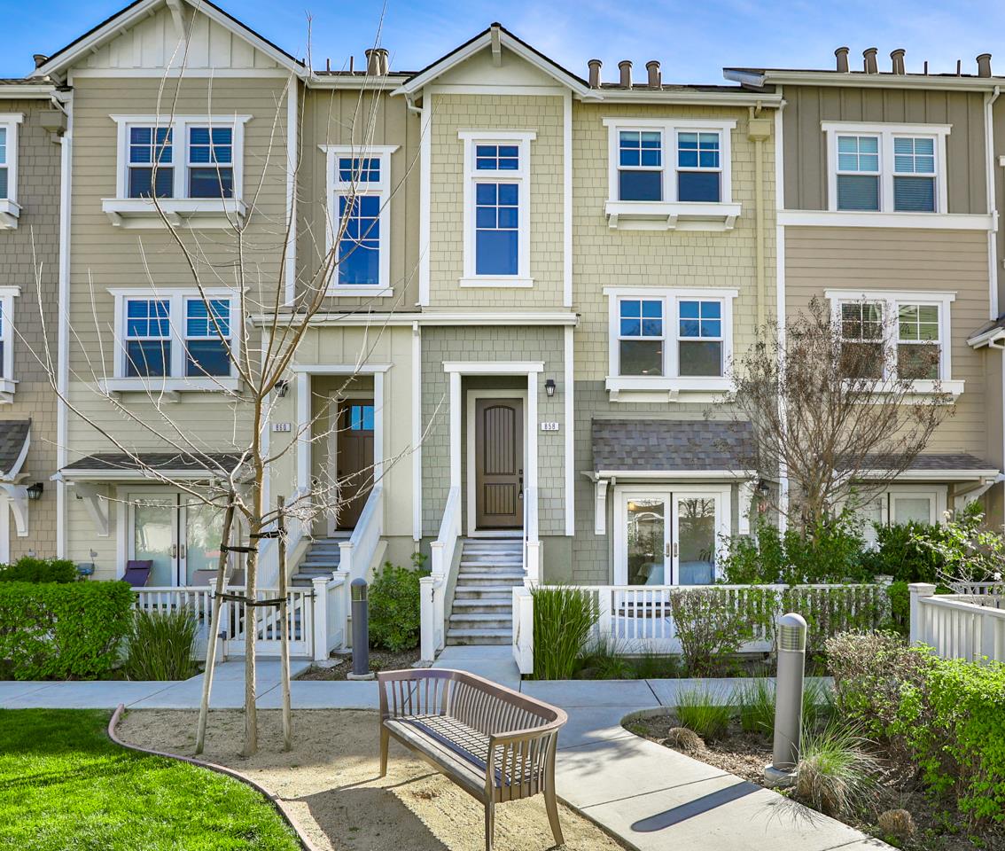 a view of a brick building next to a yard