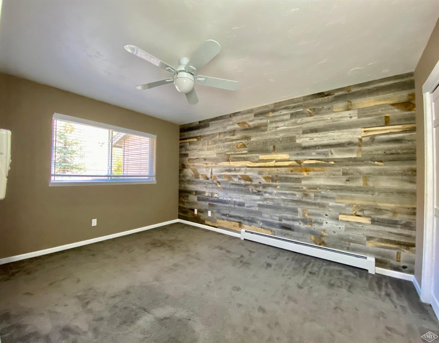 2455 Old Trail Road, Unit D Avon, CO 81620 - Photo 14 of 23 Upstairs Bedroom #2 with Wood Accent Wal