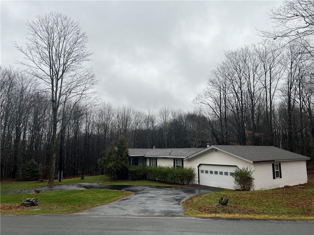 298 Radcliff Road Liberty, NY 12754 - Photo 1 of 1 a front view of a house with garden