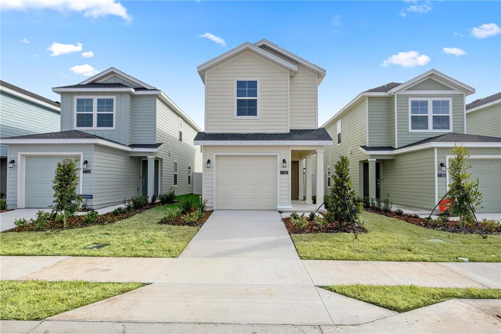 7195 Southwest 92nd Street Ocala, FL 34476 - Photo 5 of 7 front view of house with a yard