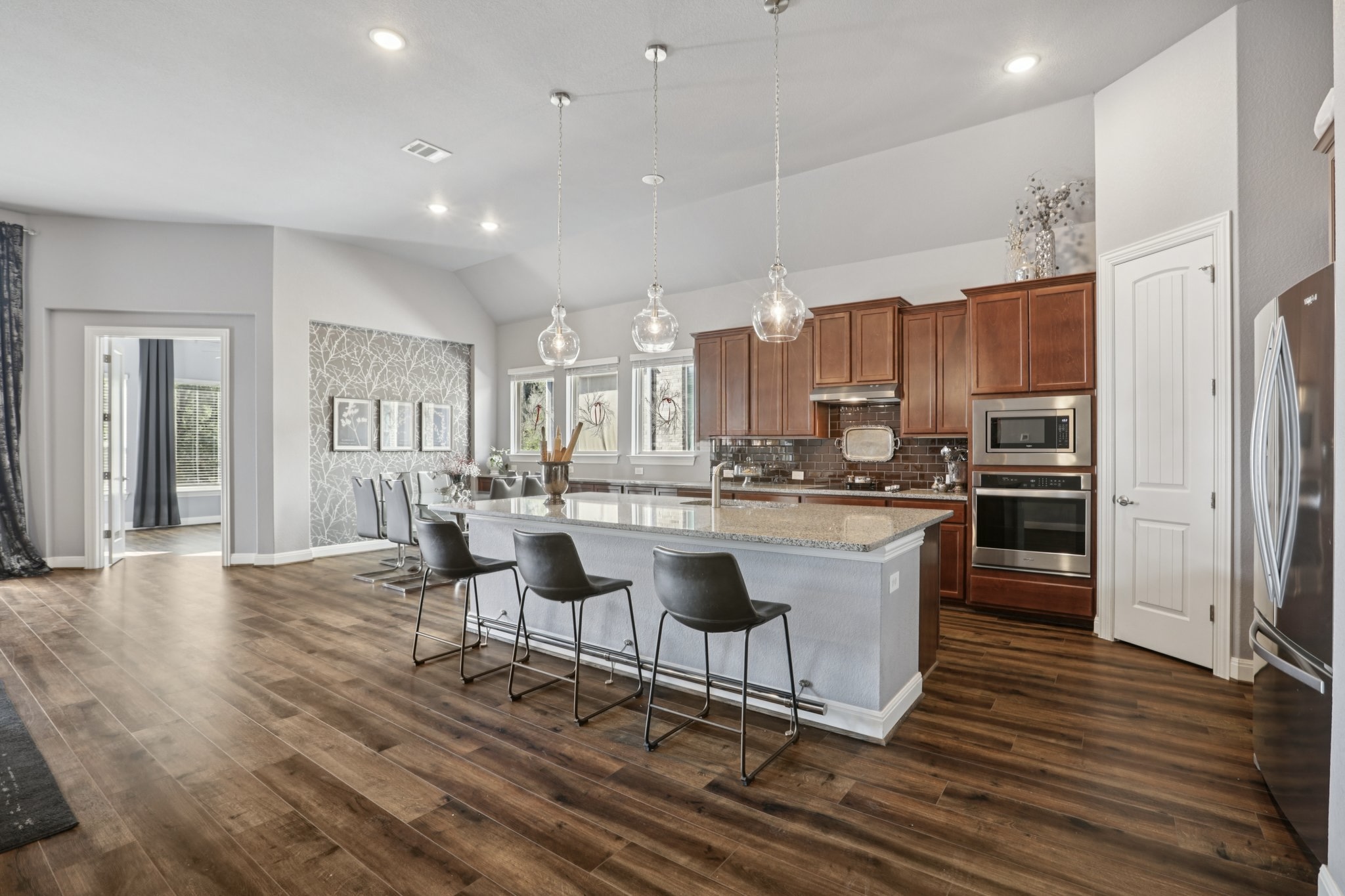210 Barton Run Drive Georgetown, TX 78628 - Photo 12 of 40 a kitchen with a sink cabinets and wooden floor