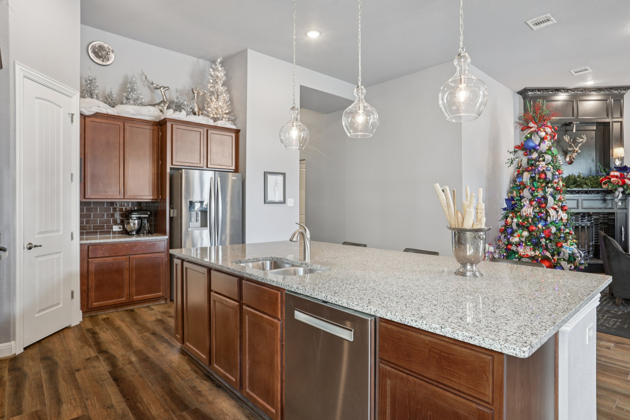 210 Barton Run Drive Georgetown, TX 78628 - Photo 17 of 40 a kitchen with stainless steel appliances kitchen island granite countertop a sink and cabinets