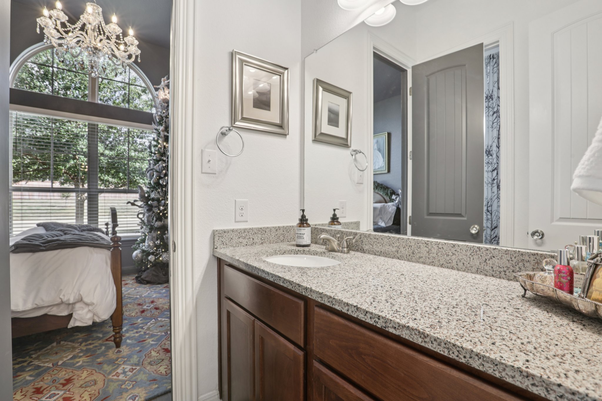 210 Barton Run Drive Georgetown, TX 78628 - Photo 20 of 40 a bathroom with a granite countertop sink and a mirror