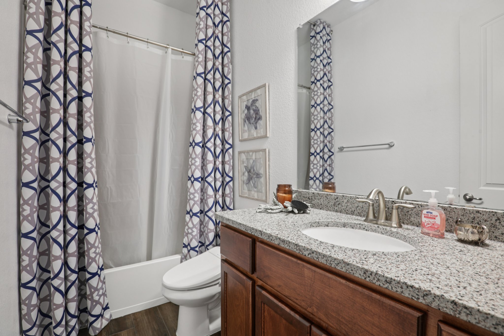 210 Barton Run Drive Georgetown, TX 78628 - Photo 25 of 40 a bathroom with a granite countertop sink and a toilet