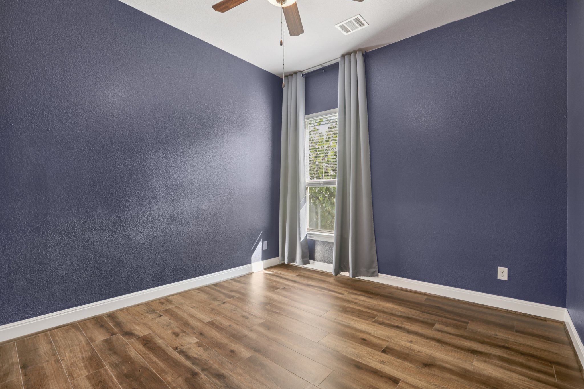 210 Barton Run Drive Georgetown, TX 78628 - Photo 27 of 40 a view of a livingroom with wooden floor and a window