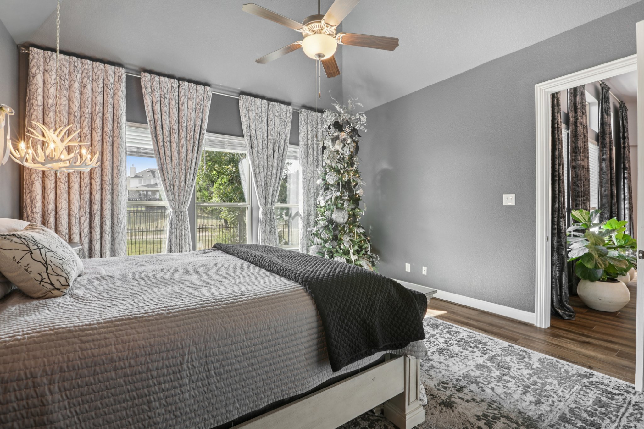 210 Barton Run Drive Georgetown, TX 78628 - Photo 31 of 40 a bedroom with a bed and a potted plant