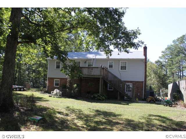9007 Winterpock Road Chesterfield, VA 23832 - Photo 5 of 6 a view of a house with a yard and tree s