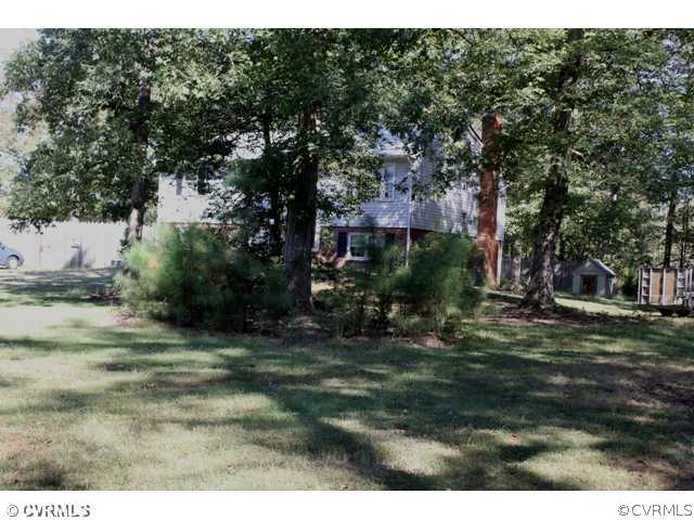 9007 Winterpock Road Chesterfield, VA 23832 - Photo 6 of 6 a backyard of a house with lots of green space