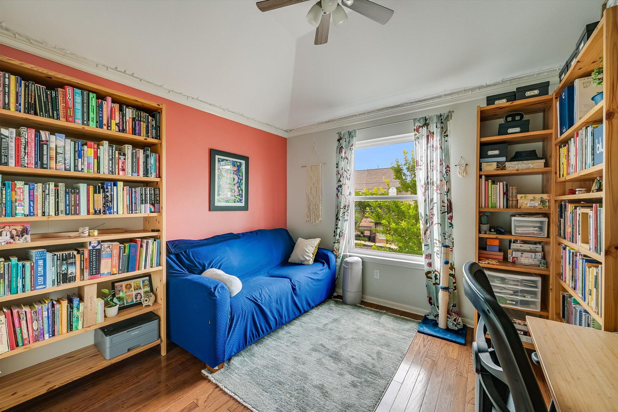6456 Ruxton Lane Austin, TX 78749 - Photo 20 of 30 A versatile space features built-in shelving, hardwood flooring, and a window with vibrant outdoor views.