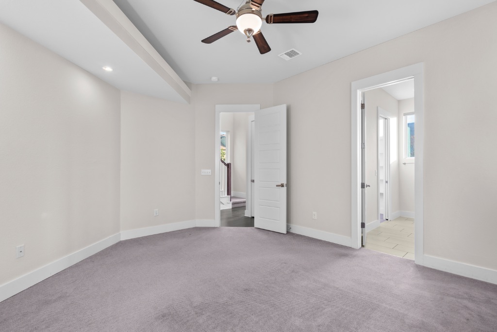 1004 Banyon Street Austin, TX 78757 - Photo 16 of 33 an empty room with chandelier fan