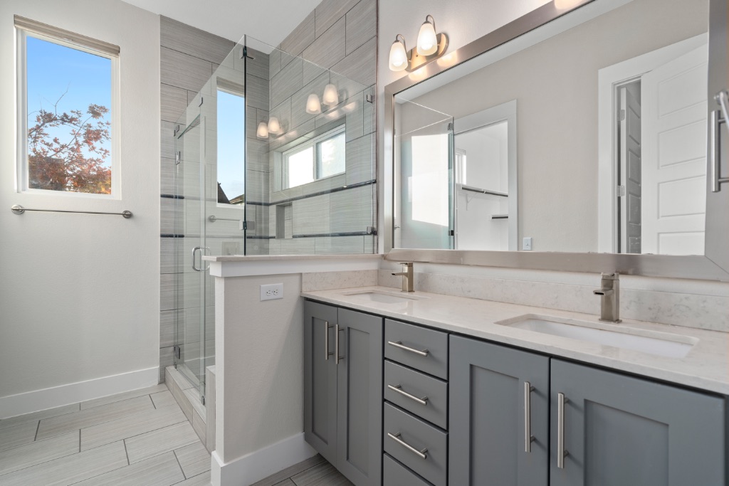1004 Banyon Street Austin, TX 78757 - Photo 17 of 33 a bathroom with a double vanity sink mirror and a