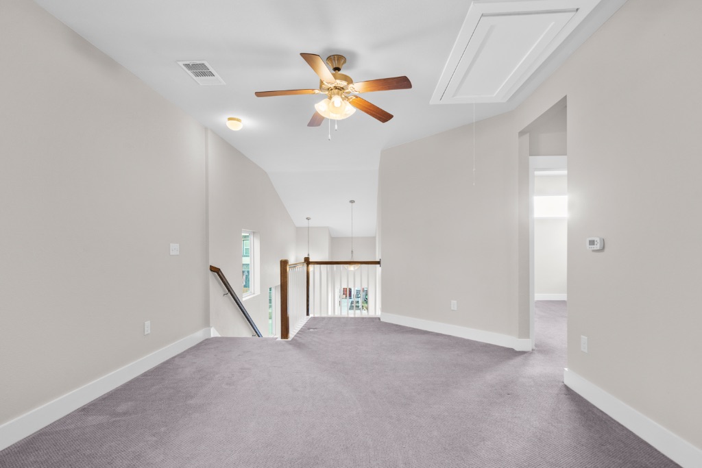 1004 Banyon Street Austin, TX 78757 - Photo 21 of 33 a view of a livingroom with a ceiling fan and window