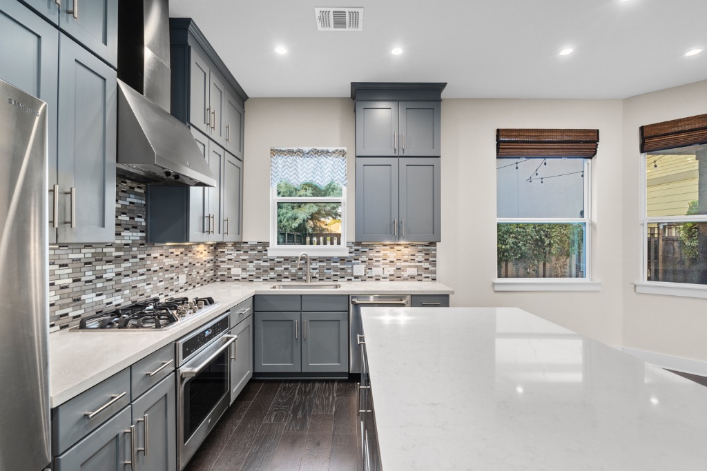 1004 Banyon Street Austin, TX 78757 - Photo 10 of 33 a kitchen with a sink stove and cabinets