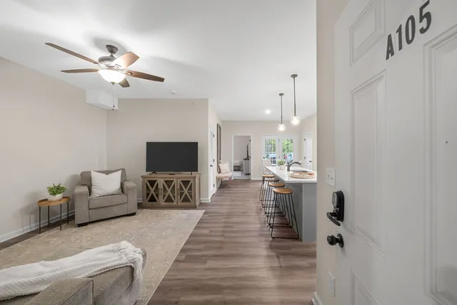 a living room with furniture and a flat screen tv