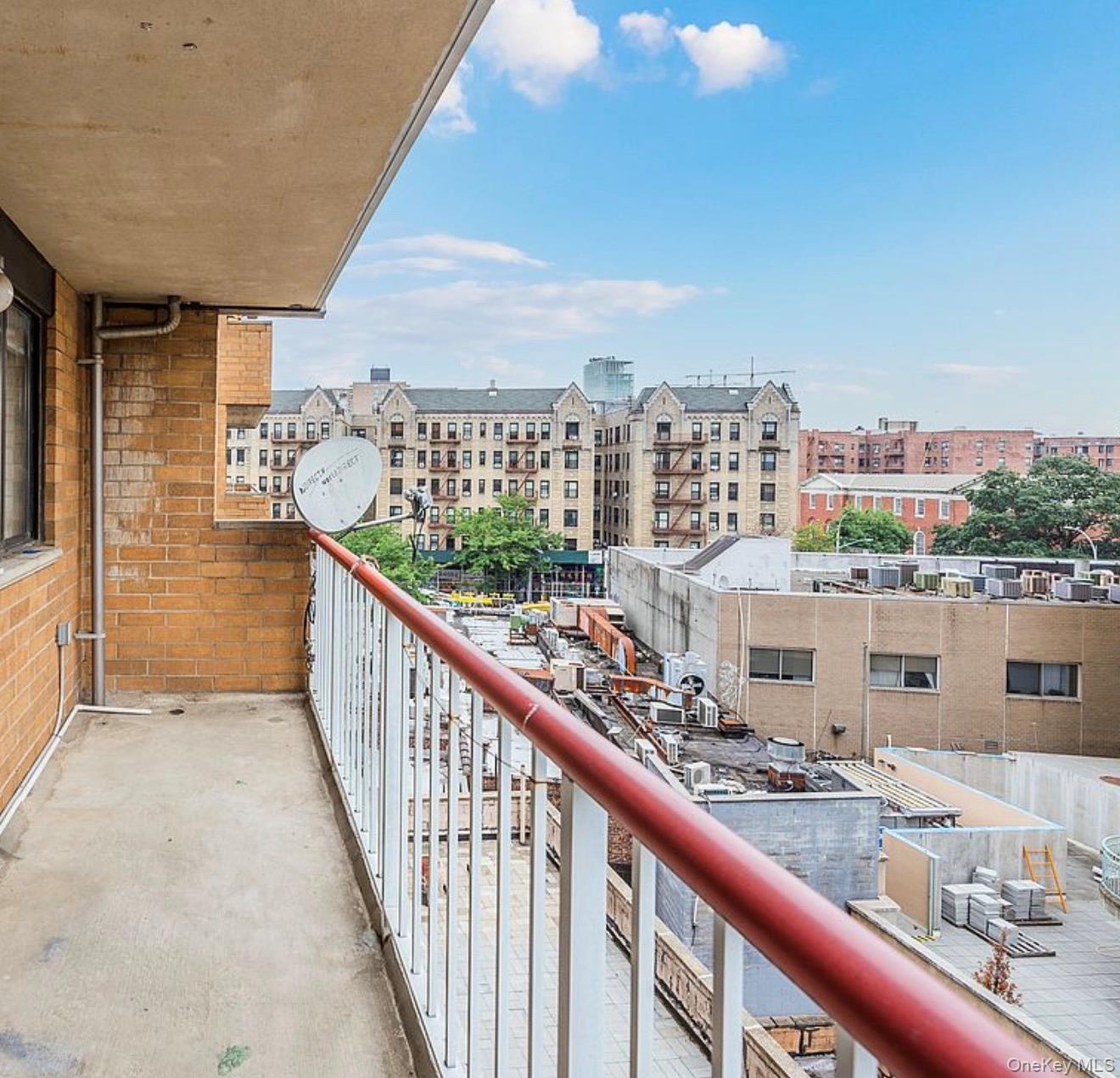 133-36 41st Road, Unit 8F Queens, NY 11355 - Photo 16 of 18 Private Balcony / City Views – Enjoy fresh air and open city views from the private balcony, offering space for outdoor seating and relaxation. Elevated vantage points provide a pleasant outlook over the surrounding neighborhood and skyline.