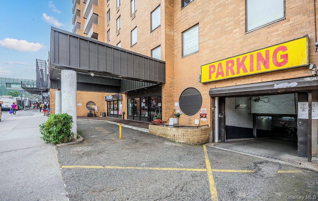 133-36 41st Road, Unit 8F Queens, NY 11355 - Photo 17 of 18 uilding Entrance / Parking Access – The building offers a covered entrance with convenient access to on-site parking. Street-level retail and services nearby contribute to the vibrant neighborhood setting.