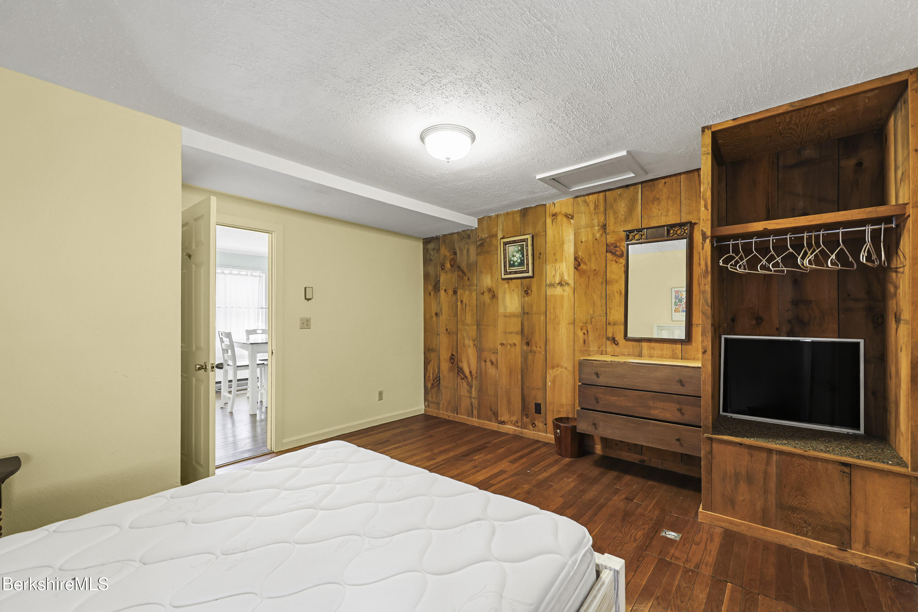88 East Windsor Road Peru, MA 01235 - Photo 16 of 47 a bedroom with a bed and a television