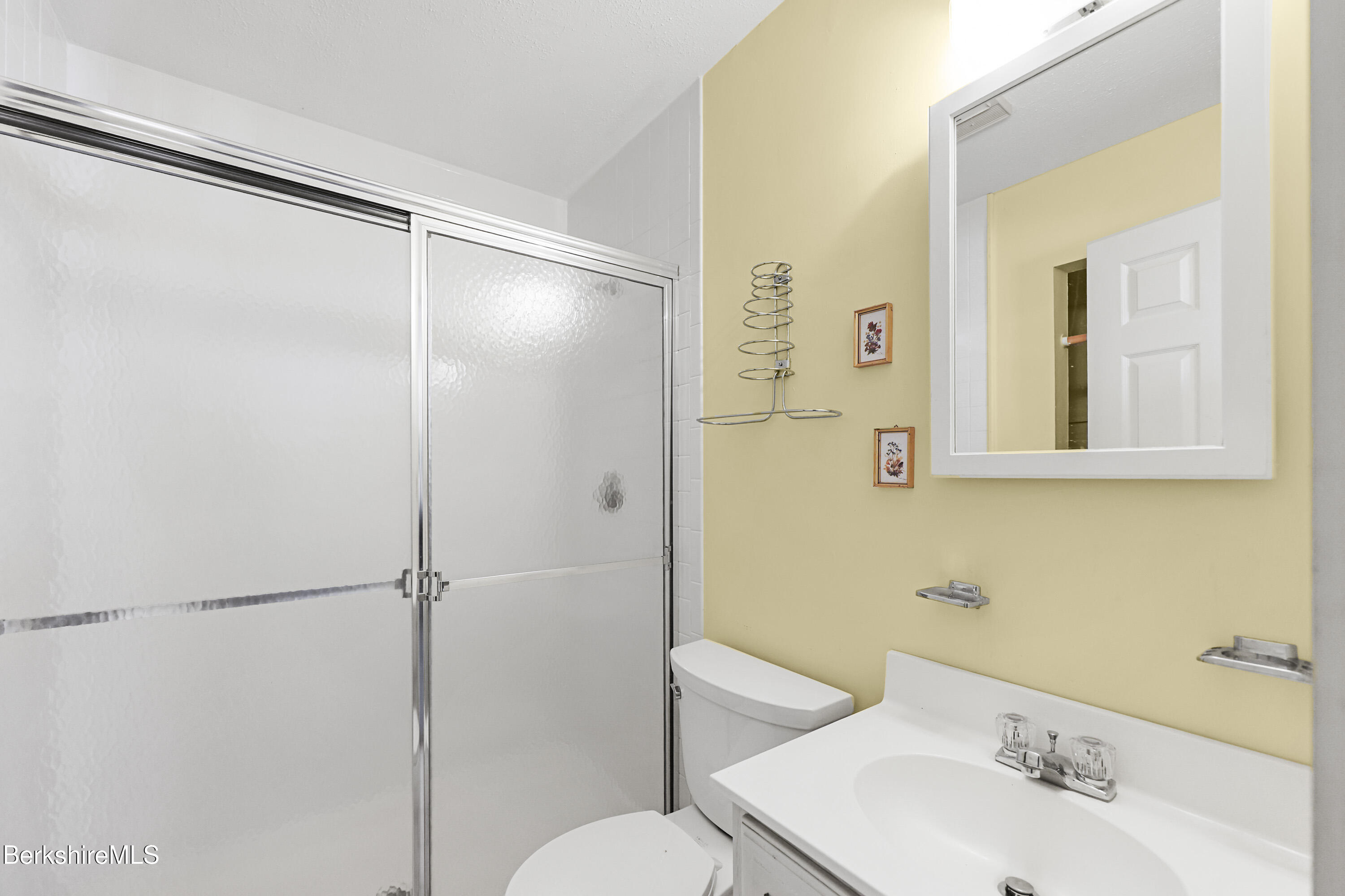 88 East Windsor Road Peru, MA 01235 - Photo 20 of 47 a bathroom with a shower sink vanity and toilet