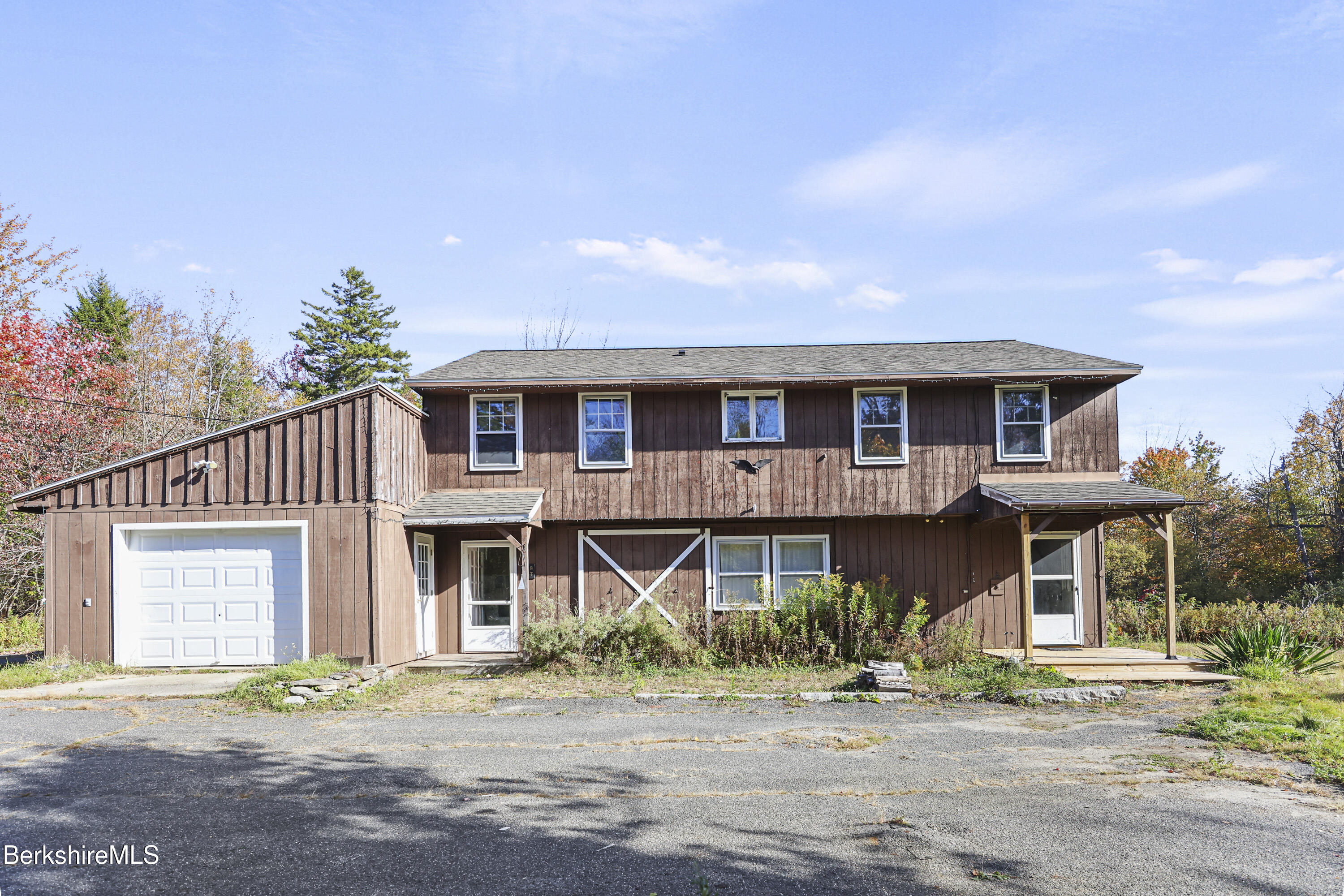 88 East Windsor Road Peru, MA 01235 - Photo 2 of 47 a front view of a house with a garden