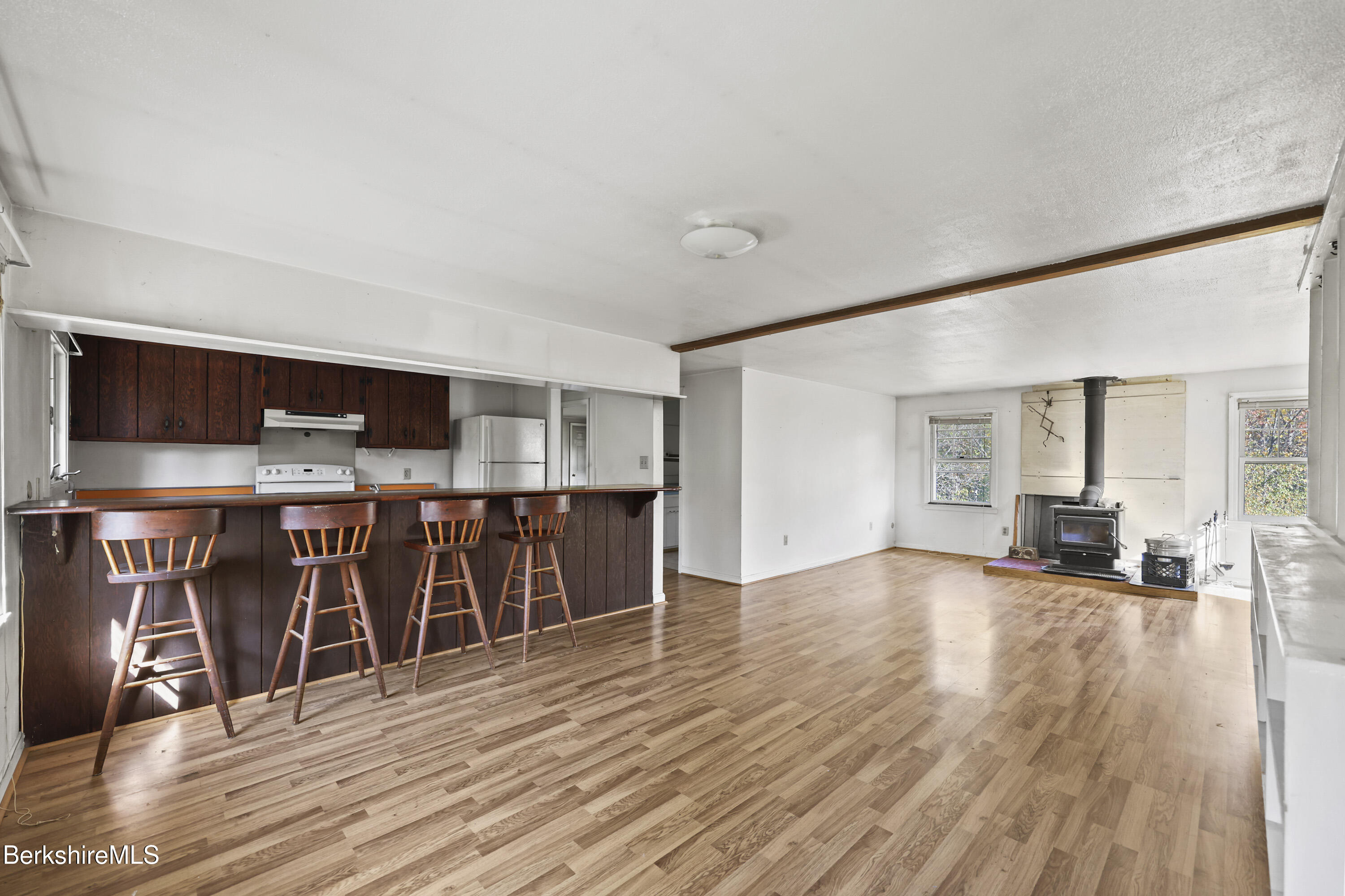 88 East Windsor Road Peru, MA 01235 - Photo 29 of 47 a view of a living room hardwood floor and a kitchen