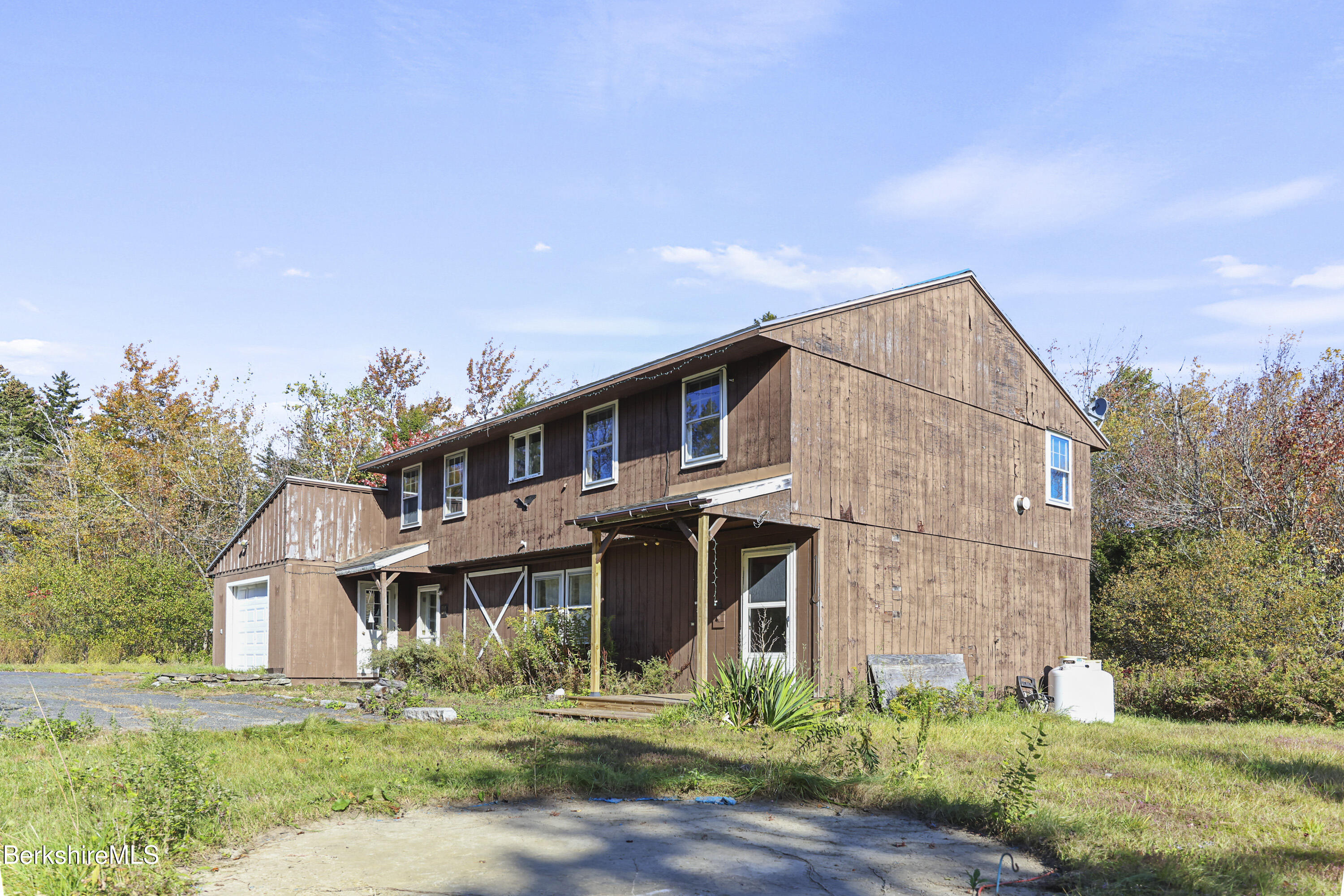 88 East Windsor Road Peru, MA 01235 - Photo 3 of 47 a view of a big house with a yard and plants