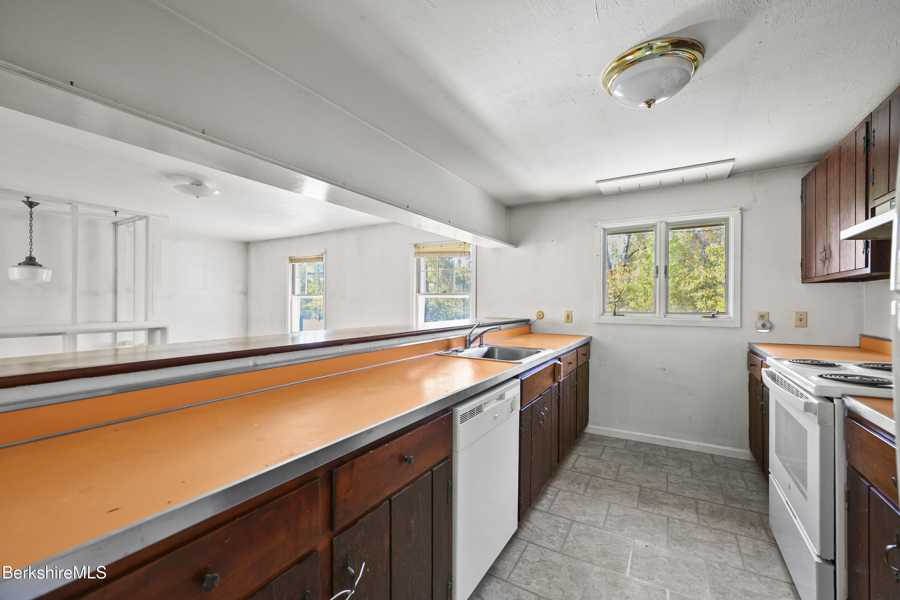 88 East Windsor Road Peru, MA 01235 - Photo 32 of 47 a kitchen with stainless steel appliances granite countertop a sink and a stove