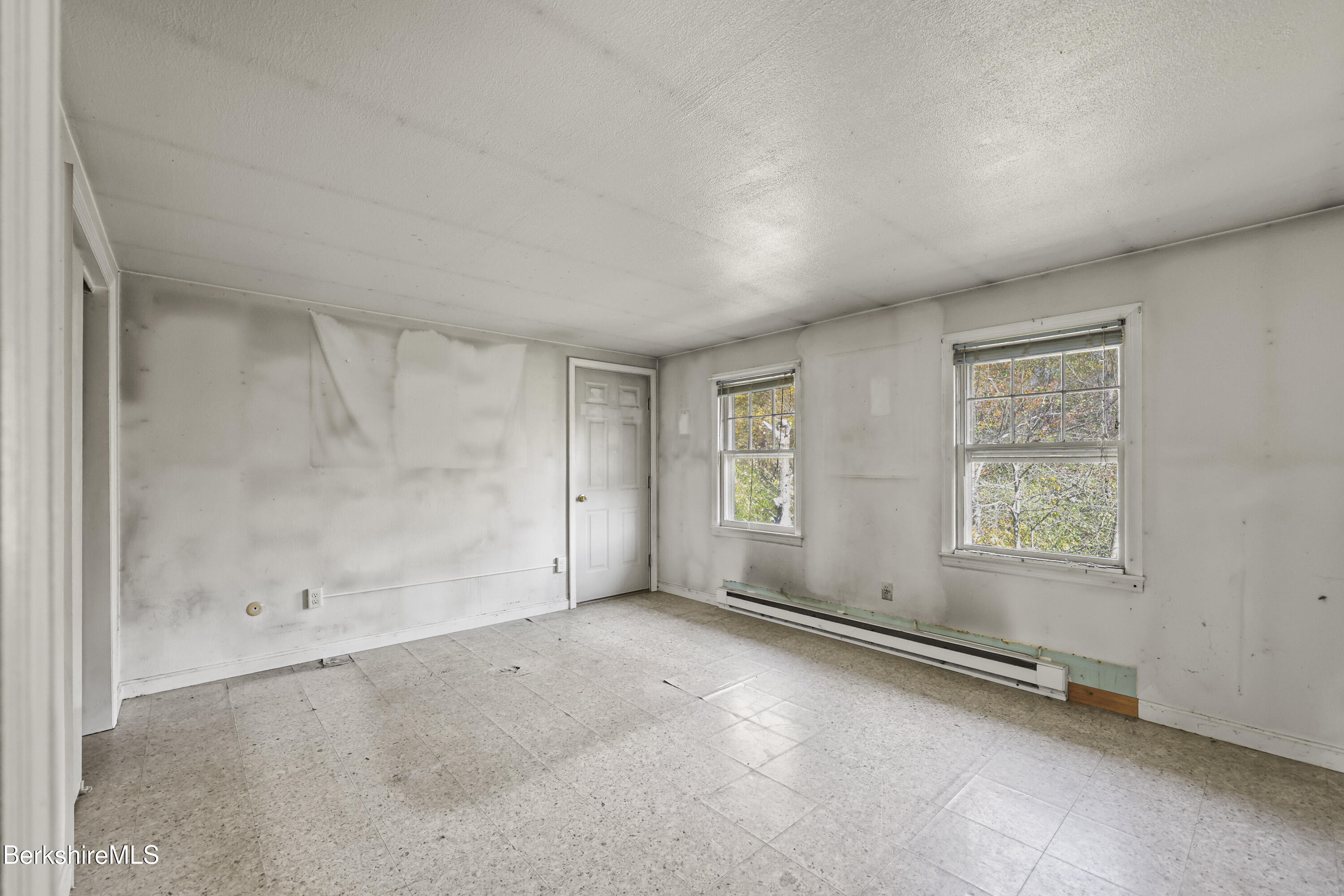 88 East Windsor Road Peru, MA 01235 - Photo 35 of 47 an empty room with a empty space and windows