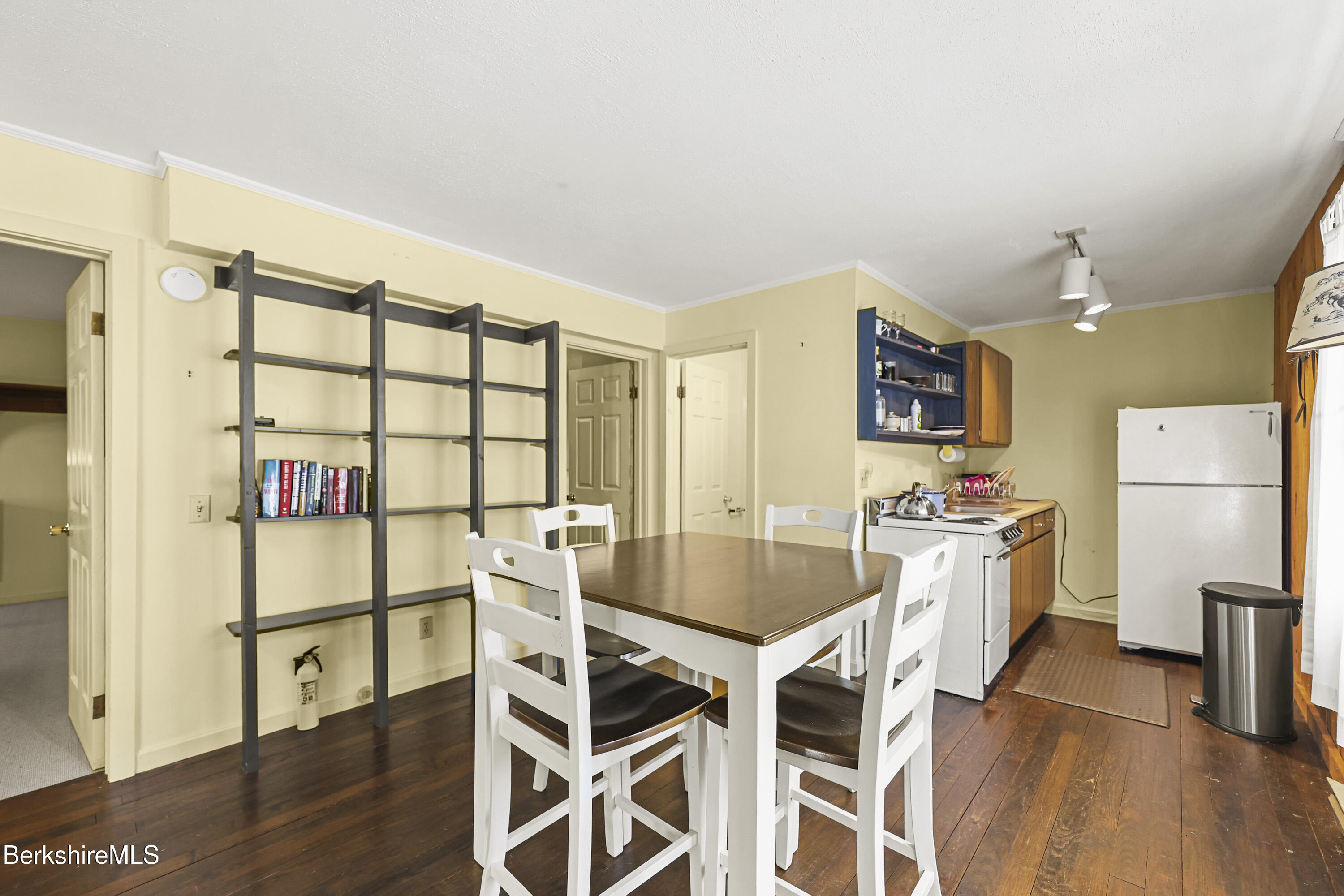 88 East Windsor Road Peru, MA 01235 - Photo 10 of 47 a kitchen with stainless steel appliances kitchen island granite countertop a table chairs and a refrigerator