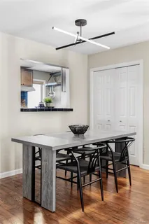a kitchen with a table and chairs in it