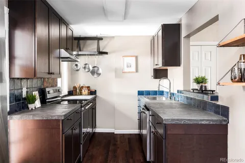 a kitchen with a sink stove and refrigerator