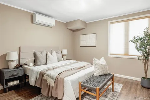 a bedroom with bed and window