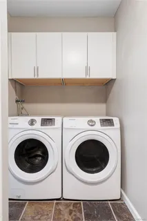 a utility room with dryer and washer