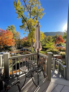 a view of a balcony with chairs